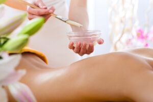 Wellness - woman receiving body or back massage in spa